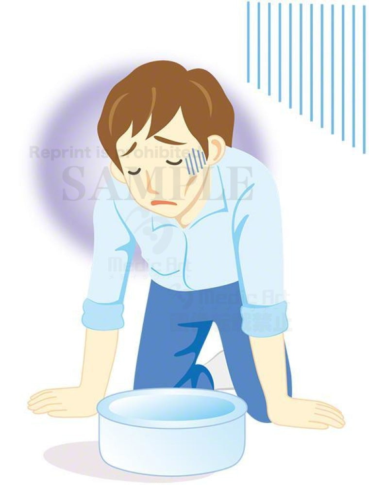 嘔吐（おうと）をしている男性